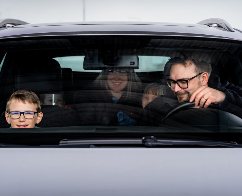 Family waiting to board Aurora Botnia with car