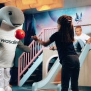 Wenni playing ball with the children