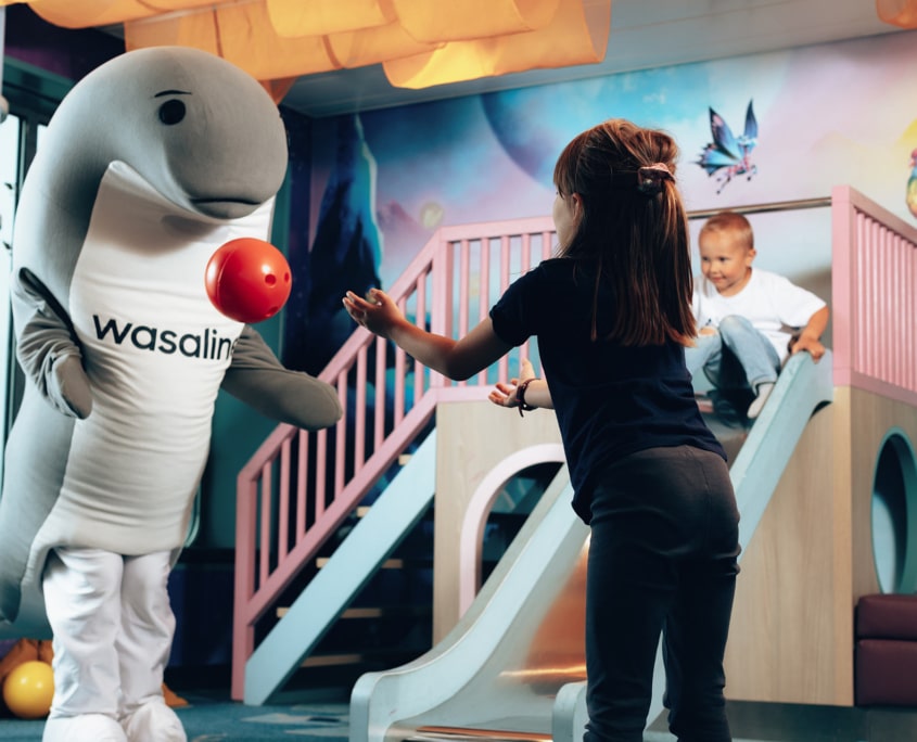 Wenni playing ball with the children