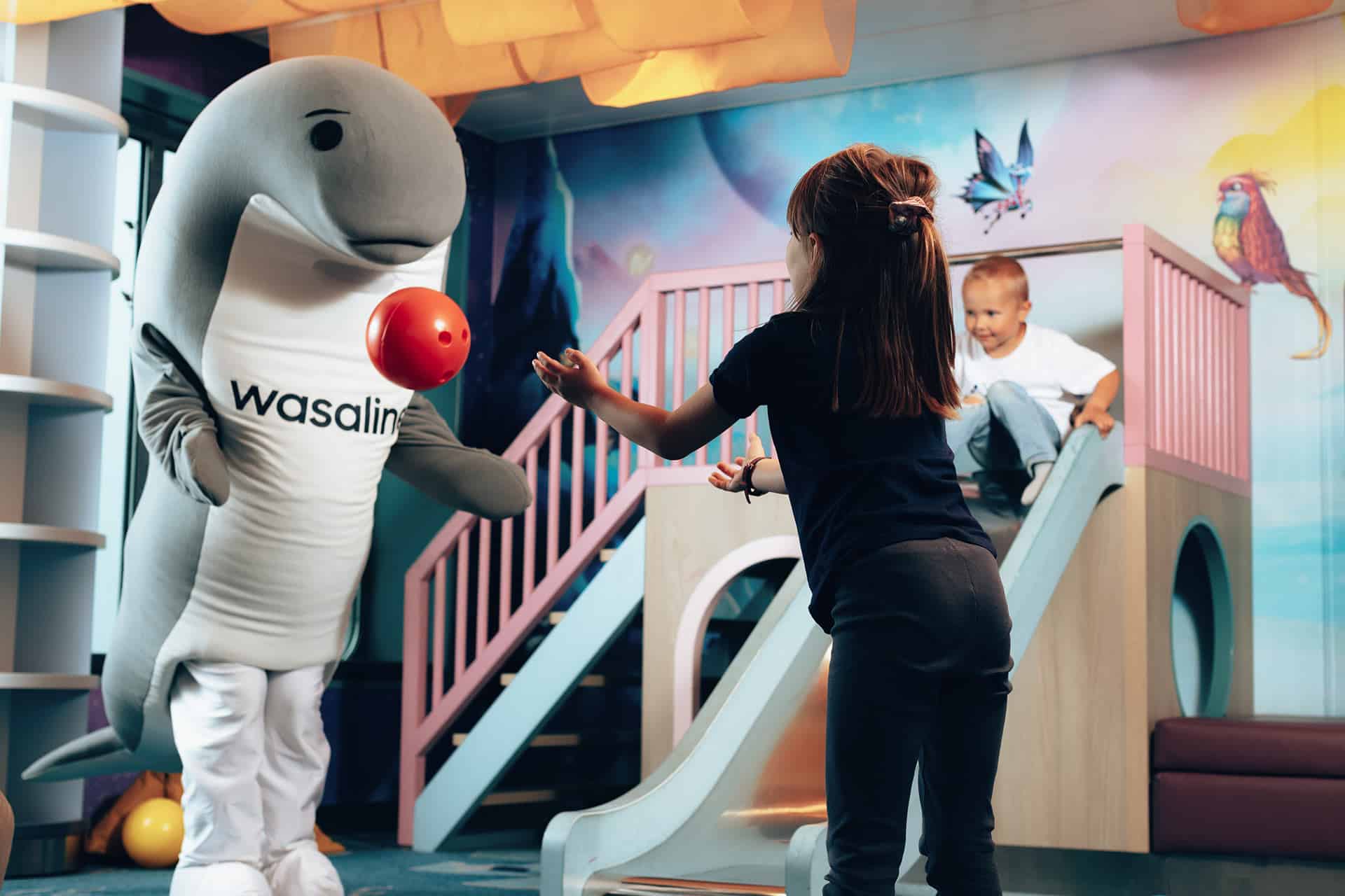 Wenni playing ball with the children